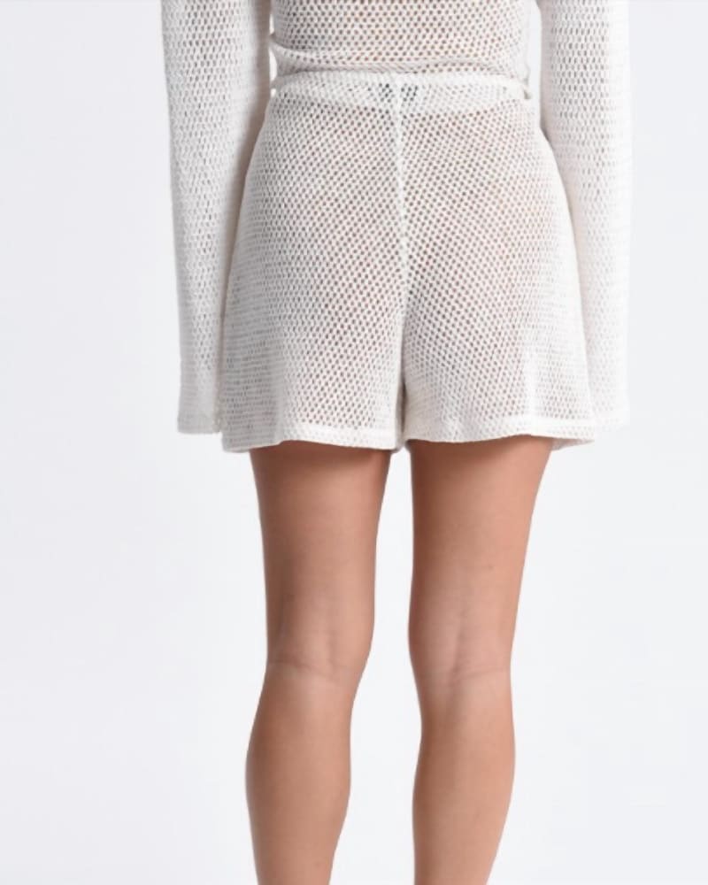Back of a model wearing a size L Chelsea Beach Short In White in White by MOLLY BRACKEN. | dia_product_style_image_id:352123
